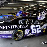 the infinite hero race car, sitting in a garage